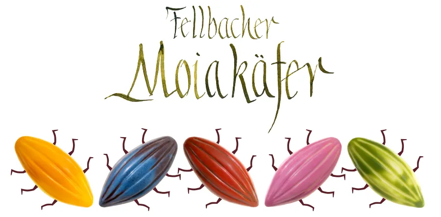 Fellbacher Moiakäfer Pralinen in vielen verschiedenen Farben: Rosa, rotbraun, Grün, Dunkelblau, Gelb